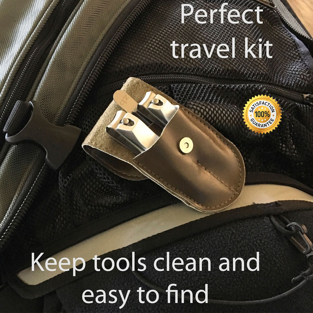 fingernail clipper, toenail clipper, and nail file inside open brown case.  "Perfect travel kit"