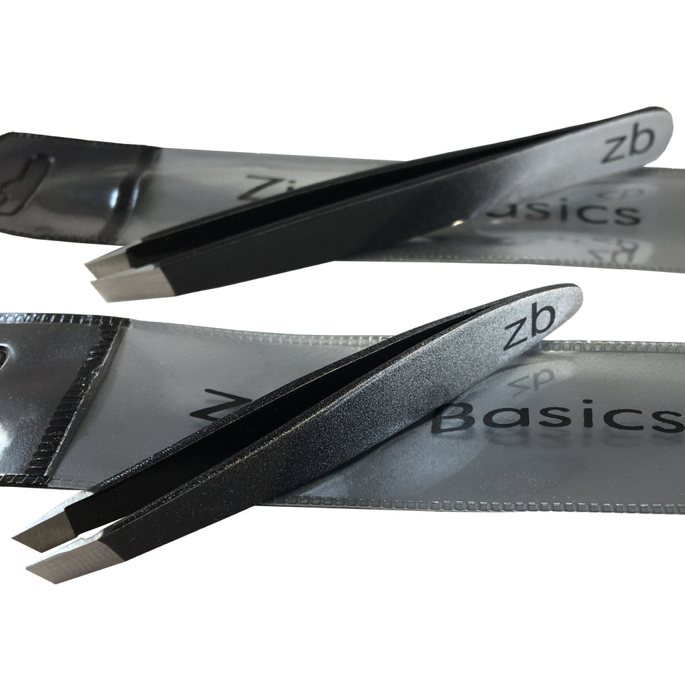 small and regular tweezers on top of their own carry pouches