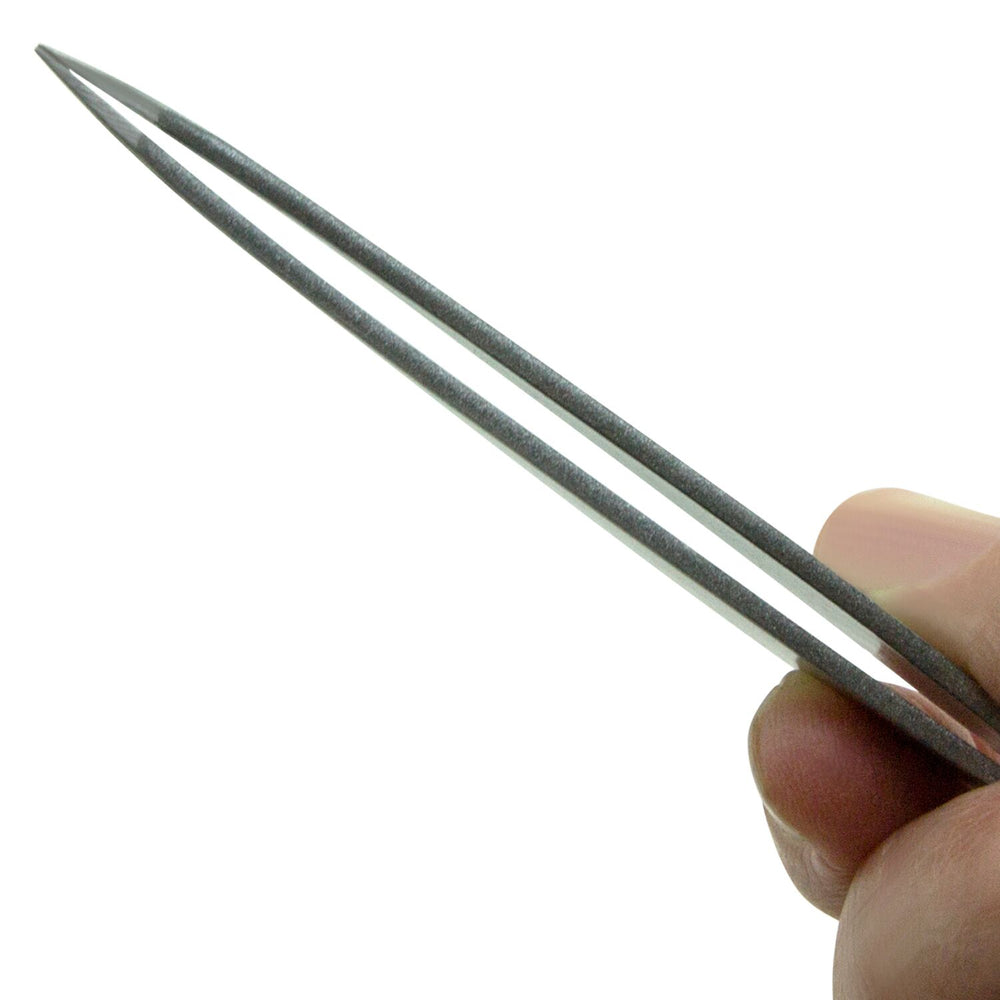 fingers pinching tweezers, shows pointed tips
